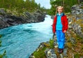 Girl near mountain river waterfalls (Norge) Royalty Free Stock Photo