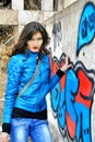 Girl near a painted wall Royalty Free Stock Photo