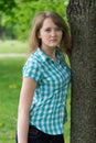 Girl near the tree Royalty Free Stock Photo