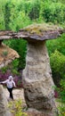 Girl neatly is faring the bottom attractions Yakutia - errozitsionnoy forms terrain sandy mushroom in the forest