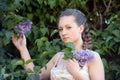Girl next to a flowering lilac Royalty Free Stock Photo