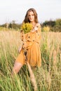 Girl with nosegay in field Royalty Free Stock Photo