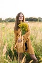 Girl with nosegay in field Royalty Free Stock Photo