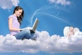 Girl with notebook on cloud and little angel Royalty Free Stock Photo