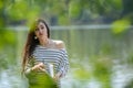 Girl with a notebook in park near the river Royalty Free Stock Photo