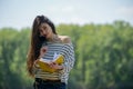 Girl with a notebook in park near the river Royalty Free Stock Photo