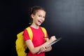 Girl with notebook and pencil