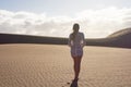 The girl observes the great dunes of the desert Royalty Free Stock Photo