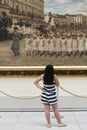 A girl observes a large painting
