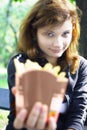 Girl offering french fries