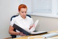 Girl office Manager looking at documents. concentrated