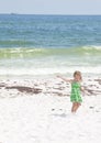 Girl by oil on Pensacola Beach Royalty Free Stock Photo