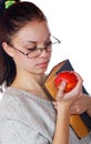 The girl with the old book and an apple Royalty Free Stock Photo