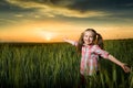 Girl open arms at sunset