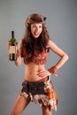 Girl in Open Cowboy Dance Costume Hat Poses with Bottle Royalty Free Stock Photo