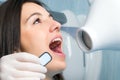 Girl with open mouth next to dental x-ray. Royalty Free Stock Photo