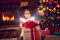 Girl opening Christmas magic presents