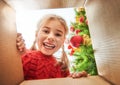 Girl opening a Christmas present Royalty Free Stock Photo