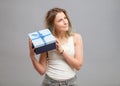 Girl opening a present isolated Royalty Free Stock Photo