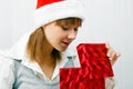 Girl opens a Christmas present Royalty Free Stock Photo