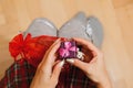 Girl opens gift box on her knees Royalty Free Stock Photo