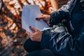 A girl opens a white envelope with a check. Payroll Check. Holding Salary Cheque. Woman With Paycheck. Royalty Free Stock Photo