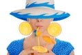 Girl with Orange Drink and Orange Slice Earrings Wearing Hat White Background Royalty Free Stock Photo