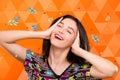 Girl on orange geometric background with birds and colorful spot