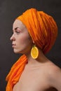 Girl with orange headscarf