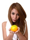 Girl with orange in her hands.