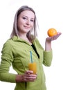 Girl with orange juice and orange in his hand Royalty Free Stock Photo