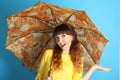 Girl with an orange umbrella Royalty Free Stock Photo