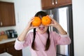 Girl With Oranges in kitchen Royalty Free Stock Photo