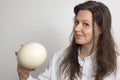 Girl with ostrich egg Royalty Free Stock Photo