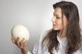 Girl with ostrich egg Royalty Free Stock Photo