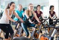 Girl and other females working out in sport club Royalty Free Stock Photo