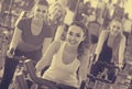 Girl and other females working out in sport club Royalty Free Stock Photo