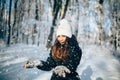 Girl outdors in the forest and catch snowflakes Royalty Free Stock Photo