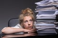 Girl overwhelmed by paperwork Royalty Free Stock Photo