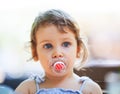 Girl with a pacifier Royalty Free Stock Photo