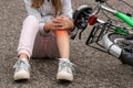 Girl in pain after a bicycle accident