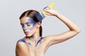 Girl with paint on her Face. Blue paint on beautiful face and Body Royalty Free Stock Photo