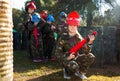 Girl paintball player in camouflage standing Royalty Free Stock Photo