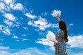 Girl Painted Beautiful Blue Sky with Her Clouds. Creative and Creation Surreal Concept Picture