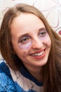 Girl painted her face, talking about dissatisfaction and sadness, but she laughs herself