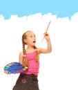 Girl painting with blue paint Royalty Free Stock Photo