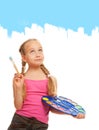 Girl painting with blue paint Royalty Free Stock Photo