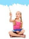 Girl painting with blue paint Royalty Free Stock Photo