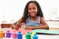 Girl Painting Picture On Table At Home