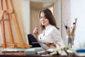 Girl paints on canvas with oil colors Royalty Free Stock Photo